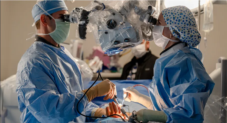 A surgeon performing microsurgery under magnification